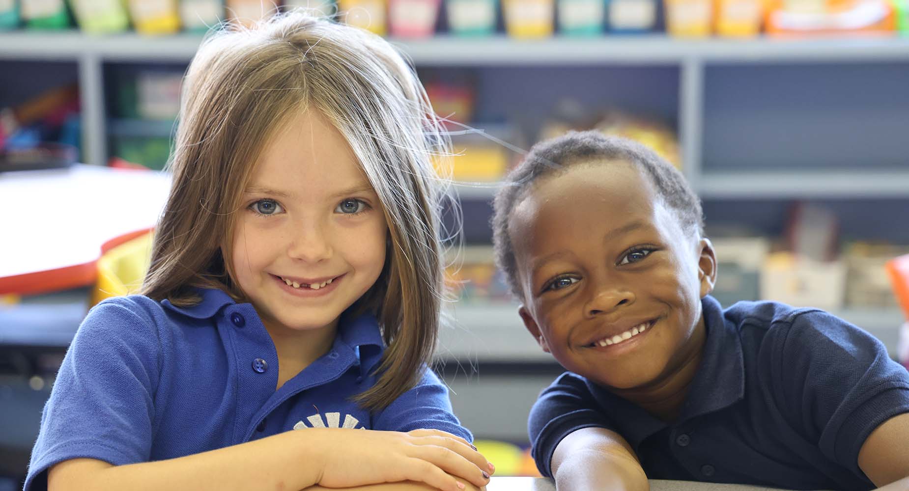 Teacher helping student