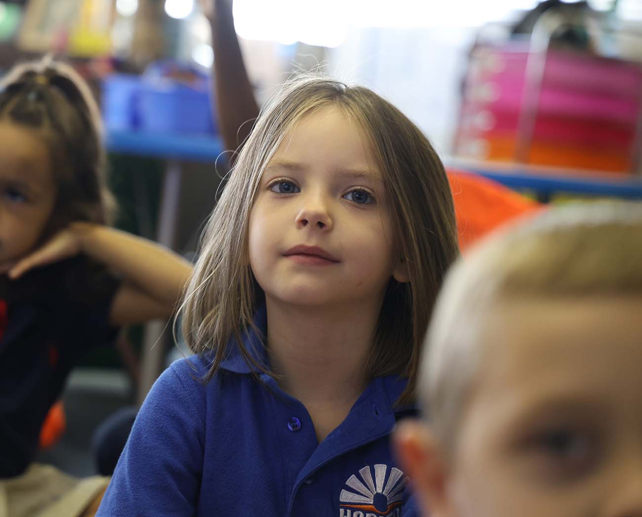 Smiling children together outdoors.